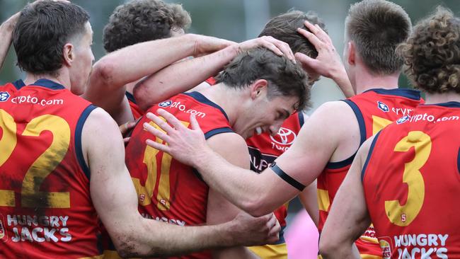 Billy Dowling from the Crows (centre) celebrates a goal with team mates during the Round 17 SANFL match between Sturt and Adelaide at Unley Oval in Adelaide, Saturday, August 19, 2023. (SANFL Image/David Mariuz)