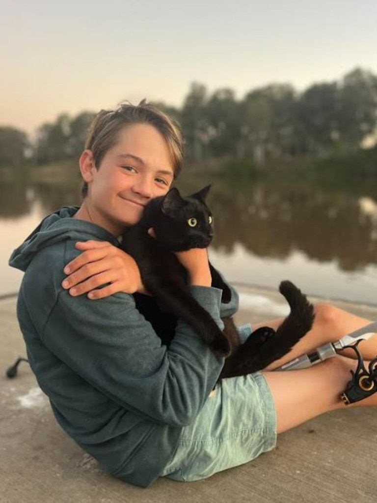 Cooper pictured with his assistance cat in training, Frankie.