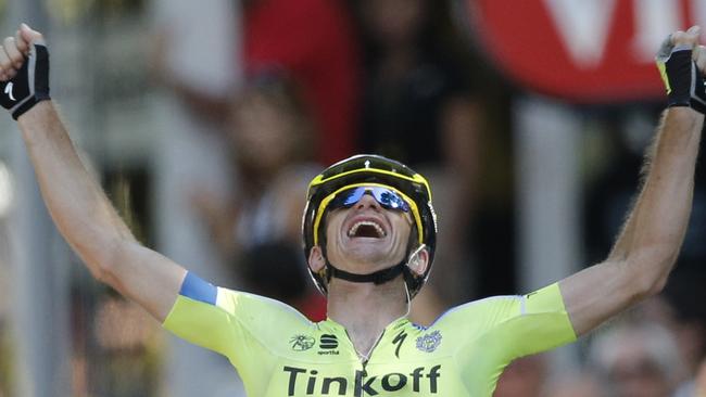 Australia's Michael Rogers crosses the finish line to win the sixteenth stage.