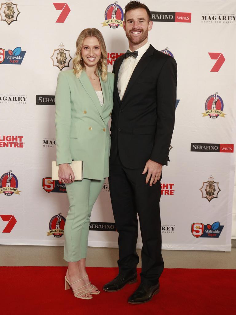 Emmalyn Otten wearing ASOS, and Andy Otten pose for a picture on the red carpet at Adelaide Oval in North Adelaide, for the Magarey Medal, Monday, September 9, 2019. Picture: Matt Loxton