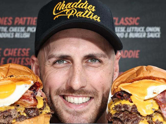 Owner Taran Lee, from Runaway Bay restaurant Chaddies Patties, with some of the Burgers that won the best burger on the Gold Coast. Picture Glenn hampson