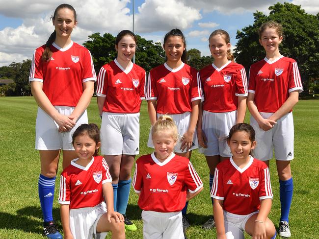 Pagewood Botany Football Club members pose for a photo at Jellicoe Park in Pagewood, Sydney, Saturday, Nov. 11, 2017. (AAP Image/Joel Carrett)