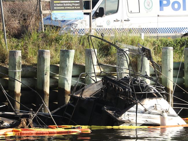 A pleasure craft with about 8 people onboard refilled at the Hawkesbury River Marina yesterday afternoon the burst into flames before sinking at Brooklyn. 6 persons were injured in the fire . Picture John Grainger