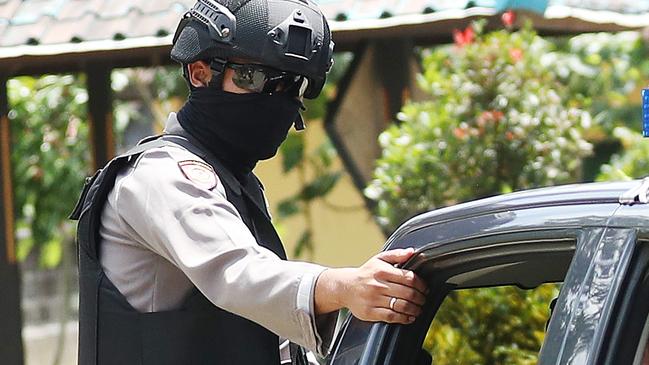 Armed police arrive at Bangli jail. Picture: Liam Kidston