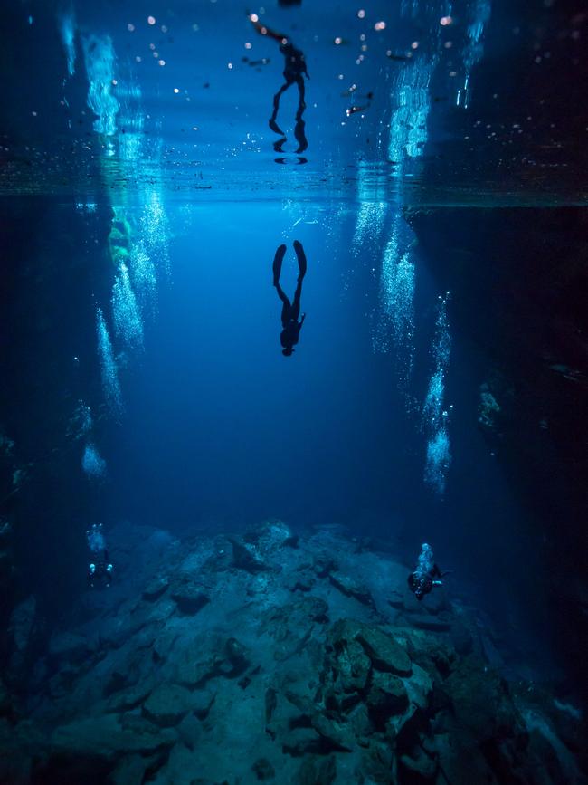 A diver explores the sinkhole. Picture: Jessie Cripps.