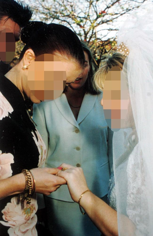 Lane (centre, white jacket) at the wedding just hours after she killed her two-day-old baby daughter Tegan.