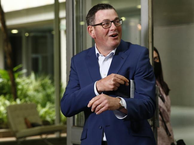 MELBOURNE, AUSTRALIA - NCA NewsWire Photos February 26, 2021:   Premier Daniel Andrews (C) reacts to reporters as he leaves after speaking during a press conference in Melbourne, Victoria. Picture: NCA NewsWire / Daniel Pockett