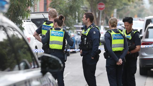 Police on the Abbotsford street. Picture: David Crosling