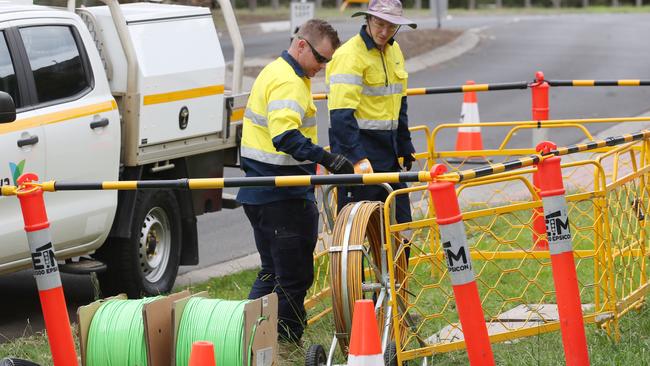 Workers install NBN cabling in the Melbourne suburb of Roxburgh Park. Picture: David Crosling