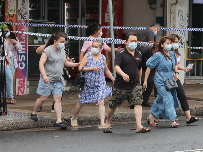 Family of the dead couple leave the shop at Cambridge Park. Picture: Rohan Kelly.