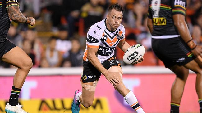 Josh Reynolds runs the ball for the Tigers during the Round 4 2019 NRL match between the Penrith Panthers and Wests Tigers. Picture: Dan Himbrechts/AAP