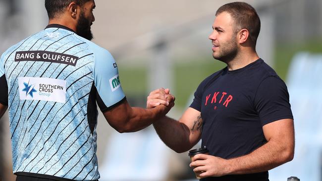 Injured Cronulla player Wade Graham speaks with Ricky Leutele during Cronulla Sharks training at Southern Cross Group Stadium, Cronulla. Picture: Brett Costello