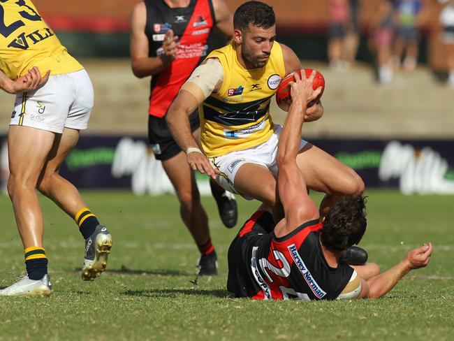 SANFL match between West Adelaide and Eagles at City Mazda Stadium. Eagles Jimmy Toumpas tangles with Wests Aaron Anderson. 19 April 2019. Picture Dean Martin