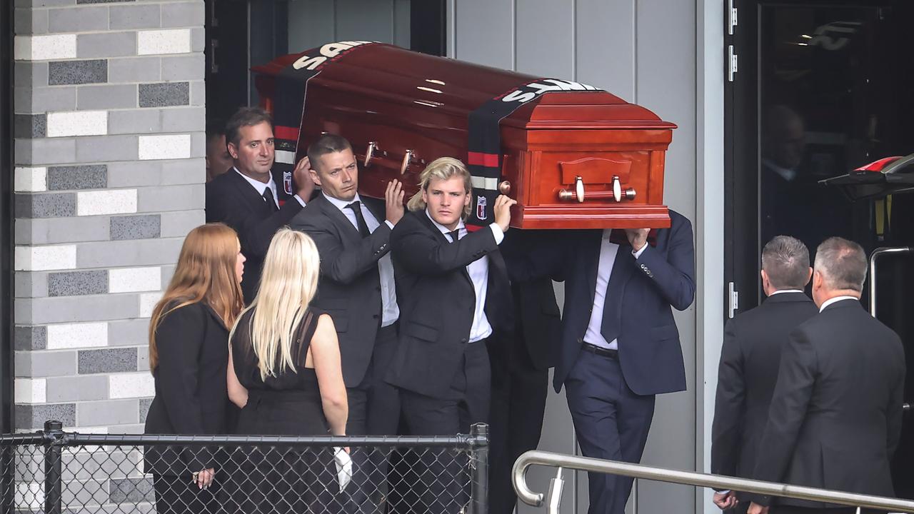 Shane Warne’s coffin is carried by pallbearers including his son Jackson, as the cricket star’s daughters, Brooke and Summer, look on. Picture: David Caird