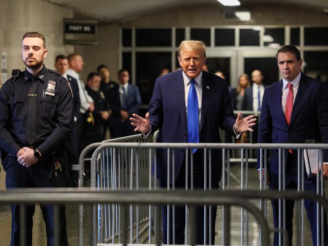 Trump occasionally speaks to reporters in a corridor outside the courtroom. Picture: Brendan McDermid/AFP