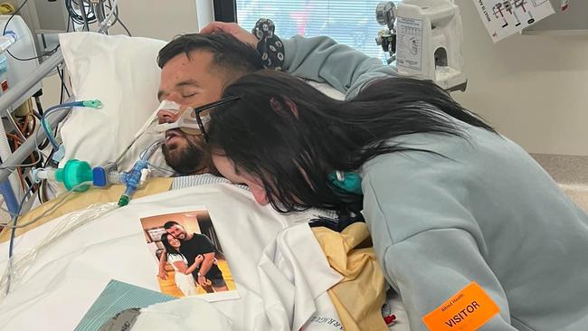 Mr Francis, pictured with his sister, Emily, at his hospital bedside, died three days after being punched at Crown casino.