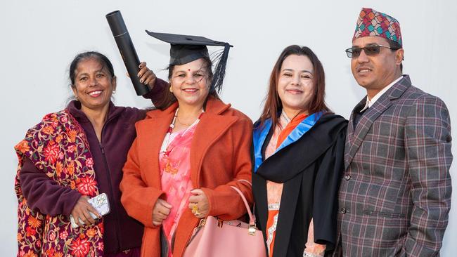 Family surrounded graduate, Pooja KC (second from right) Narayoni Khatri, (left), Dil Maya KC and Narayani Khatri. UniSQ graduation ceremony at Empire Theatre, Tuesday June 27, 2023.