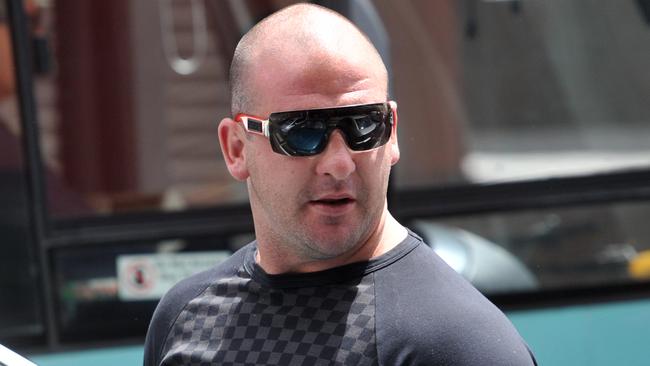 Comanchero bikie boss Mark Buddle continues to evade NSW Police overseas.