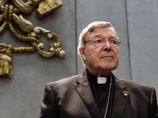 FILE - In this Thursday, June 29, 2017. file photo, Cardinal George Pell prepares to make a statement, at the Vatican. Pope Francis has removed two cardinals from his informal cabinet after they were implicated in the Catholic Church's sex abuse and cover-up scandal, shedding embarrassing advisers ahead of a high-stakes Vatican summit on abuse early next year. The Vatican said Wednesday, Dec. 12, 2018 that Francis in October had written to Chilean Cardinal Javier Errazuriz and Australian Cardinal George Pell thanking them for their five years of service on the so-called Group of Nine, or C-9. (AP Photo/Gregorio Borgia, File)