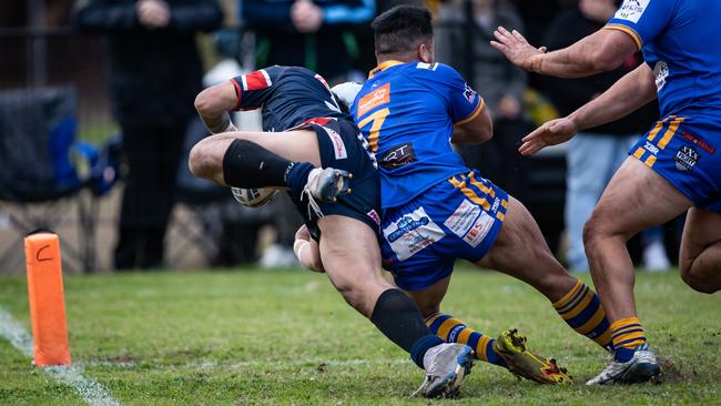 Rams winger John Ryan dives for the corner but is smashed by a try saving tackle fromKangaroos halfback Alex Seve. 4th September 2022. News Local, Picture by Julian Andrews.