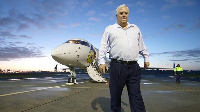 Palmer United Party federal leader Professor Clive Palmer arrives to Brisbane General aviation hanger in one of his newly pa...