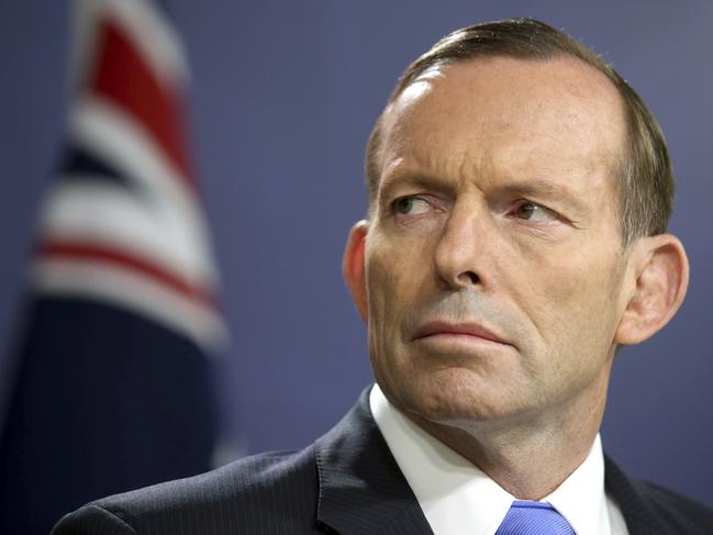 FILE - In this Sept. 19, 2014, file photo, former Australian Prime Minister Tony Abbott speaks during a press conference, in Sydney. Australiaâ€™s prime minister Friday urged restraint in the same-sex marriage debate after Abbott said he was head-butted by a gay rights advocate while walking in a city street. (AP Photo/Rick Rycroft, File)