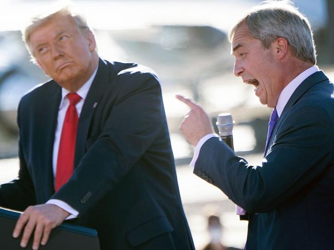 US President Donald Trump listens as Nigel Farage (R) speaks during a Make America Great Again rally at Phoenix Goodyear Airport October 28, 2020, in Goodyear, Arizona. (Photo by Brendan Smialowski / AFP)