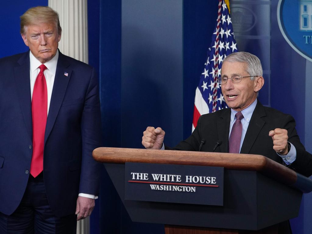 Director of the National Institute of Allergy and Infectious Diseases Anthony Fauci, flanked by US President Donald Trump. Picture: AFP