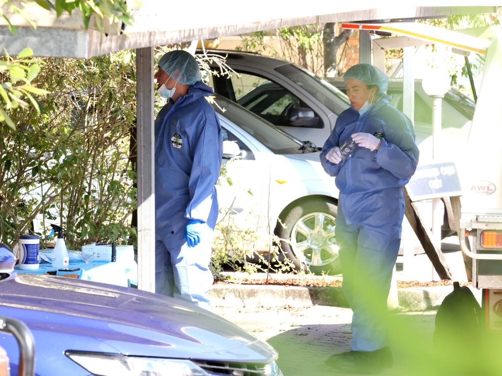 Police at the scene of a suspected homicide after the body of a man was found inside a townhouse in Torrens Rd, Caboolture South. Photo Steve Pohlner