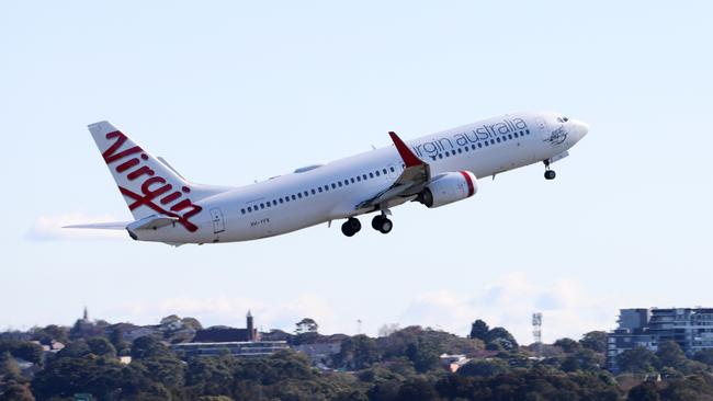 A Virgin Australia flight takes off at Sydney airport.