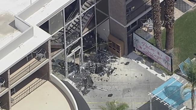 Debris covers the ground near the site of an explosion on Saturday, May 17, 2025 in Palm Springs, Calif. (ABC7 Los Angeles via AP)