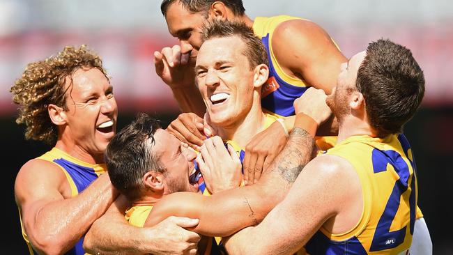 Petrie is mobbed by Eagles teammates after kicking a goal. Picture: Getty Images