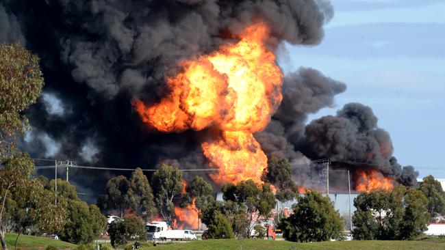 Flames and thick smoke from a factory fire in Derrimut. Picture: NewsWire / Andrew Henshaw