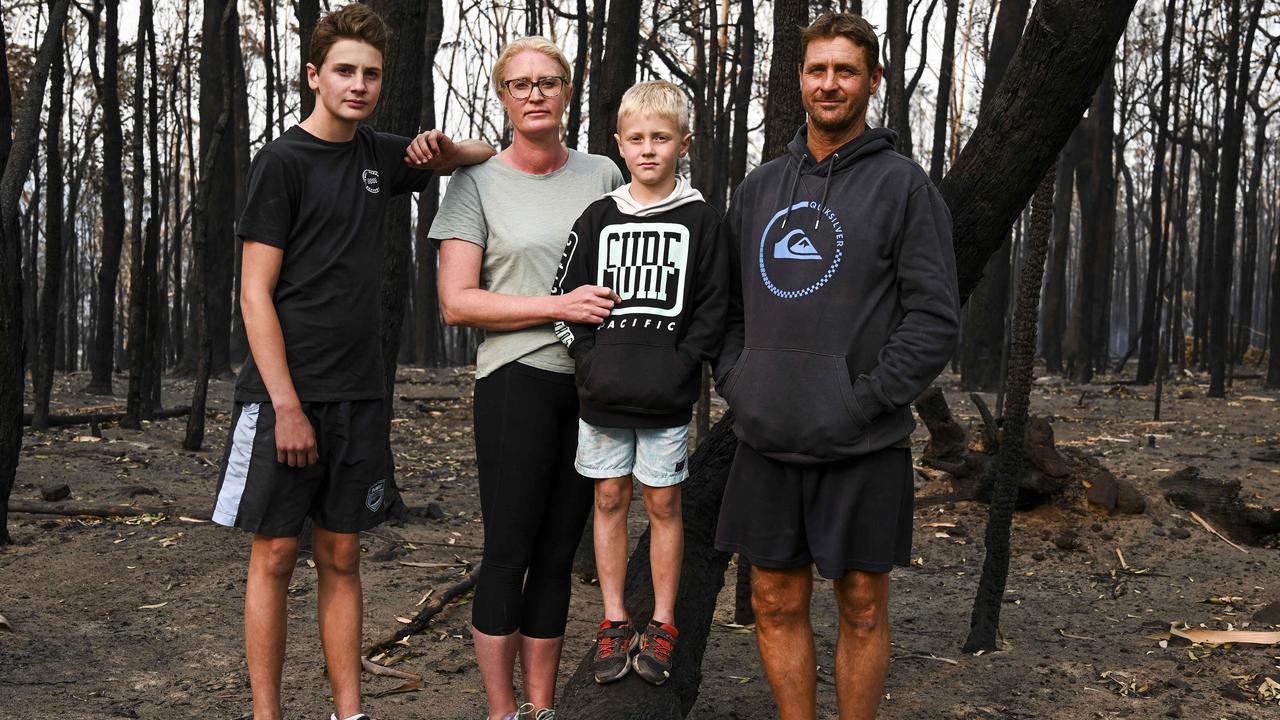 Conjola residents Nikki and Chris Morris sent their sons Taj and Alex to the water while they battled to save their family home. Picture: Darren Leigh Roberts