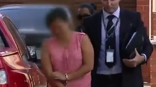 Amy Tran smiled as she was arrested on Saturday. Picture: Screengrab/Seven
