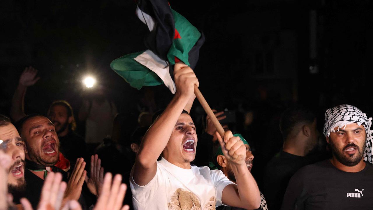 Lebanese protesters wave Palestinian national flags. Picture: AFP