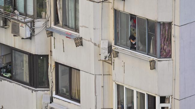 Millions have been stuck in their homes, with a chorus of people heard screaming from their windows. Picture: Hector Retamal / AFP