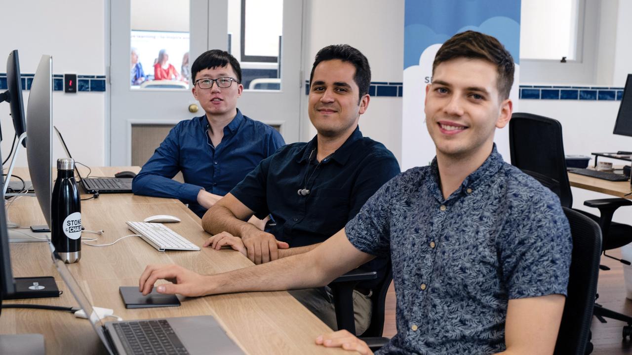 Allied health management software start-up Splose's software engineers Hao Wang, left, Roozbeh Hajizadeh and founder Mr Sanderson, right.