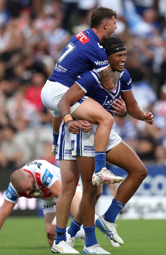 Toby Sexton jumps onto Sitili Tupouniua to celebrate a try. Picture: Getty Images