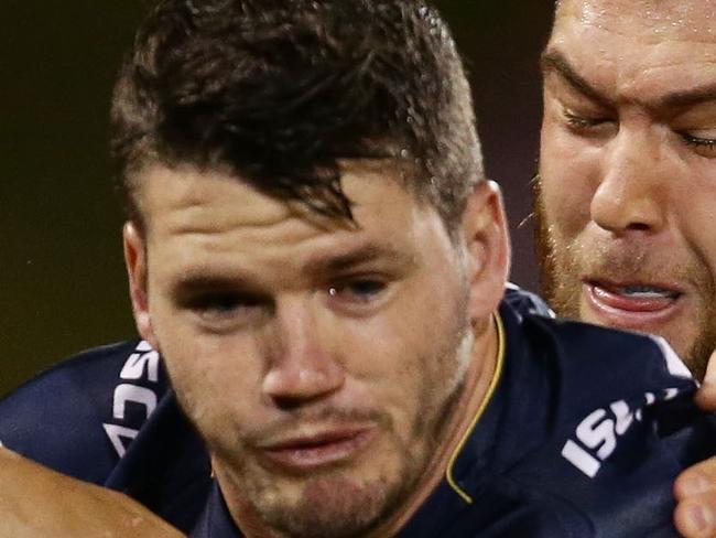 SYDNEY, AUSTRALIA - MAY 23: Lachlan Coote of the Cowboys is tackled during the round 11 NRL match between the Wests Tigers and the North Queensland Cowboys at Campbelltown Sports Stadium on May 23, 2015 in Sydney, Australia. (Photo by Matt King/Getty Images)