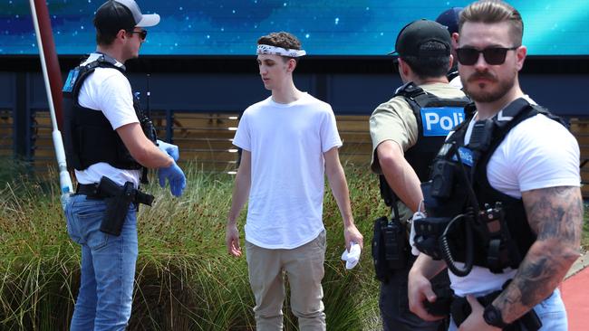 Police check a partygoer attending Juicy Fest at the Melbourne Showgrounds Picture: Brendan Beckett