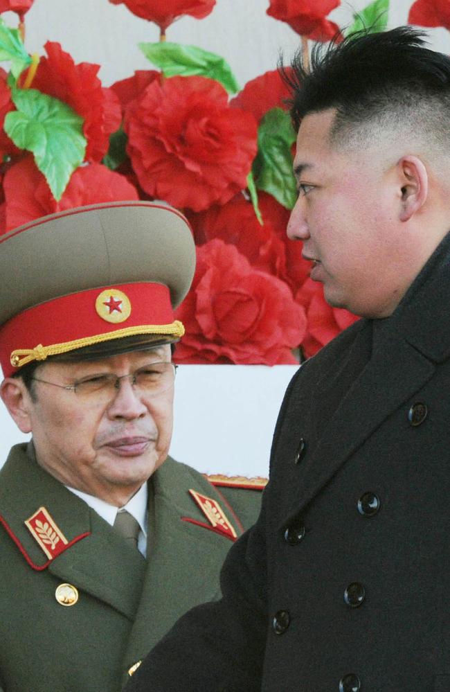 North Korean leader Kim Jong-un walks past his uncle Jang Song Thaek in 2012. Picture: AP