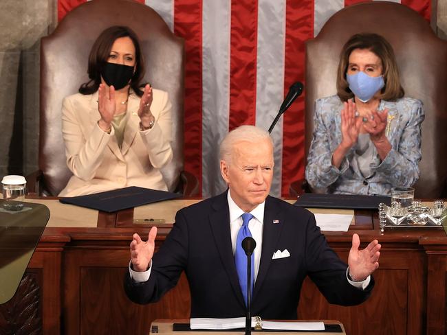 WASHINGTON, DC - APRIL 28: U.S. President Joe Biden addresses a joint session of congress as Vice President Kamala Harris (L) and Speaker of the House U.S. Rep. Nancy Pelosi (D-CA) (R) look on in the House chamber of the U.S. Capitol April 28, 2021 in Washington, DC. On the eve of his 100th day in office, Biden spoke about his plan to revive Americaâs economy and health as it continues to recover from a devastating pandemic. He delivered his speech before 200 invited lawmakers and other government officials instead of the normal 1600 guests because of the ongoing COVID-19 pandemic.   Chip Somodevilla/Getty Images/AFP == FOR NEWSPAPERS, INTERNET, TELCOS & TELEVISION USE ONLY ==