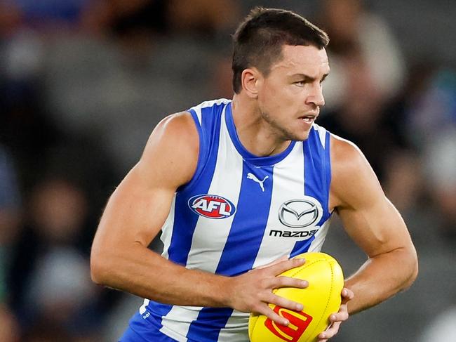 MELBOURNE, AUSTRALIA - MARCH 23: Luke Davies-Uniacke of the Kangaroos in action during the 2024 AFL Round 2 match between the North Melbourne Kangaroos and the Fremantle Dockers on March 23, 2024 in Melbourne, Australia. (Photo by Dylan Burns/AFL Photos via Getty Images)