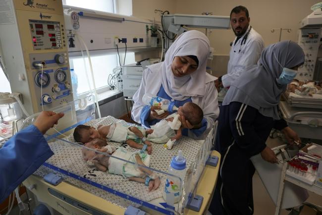 Palestinian medics care for premature babies evacuated from Al-Shifa hospital to the Emirates hospital in Rafah, in southern Gaza