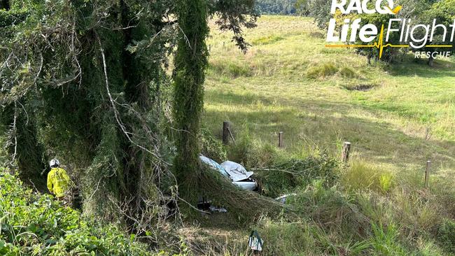 A man had to be cut out of his ute after it plunged 10m down a Bruce Hwy embankment.