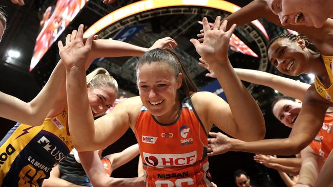 Susan Pettitt runs through a guard of honour after retiring from Super Netball.