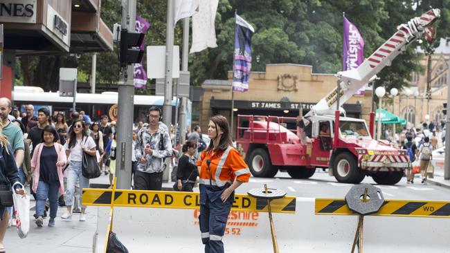 A crane is parked on the corner of Market and Elizabeth Street in Sydney's CBD during boxing day sales. Picture: Jenny Evans