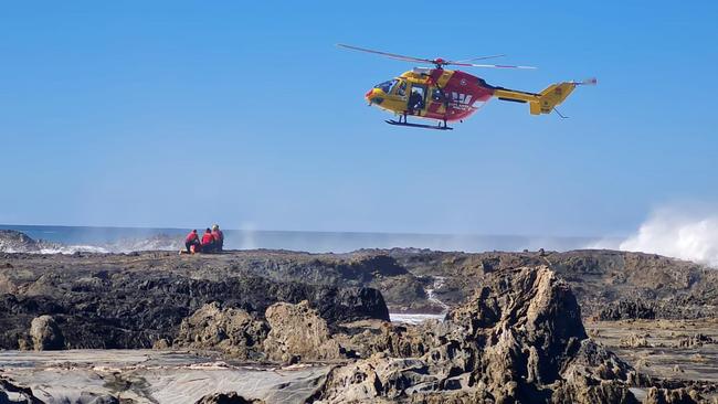 The Westpac rescue helicopter on scene at Surf Beach.