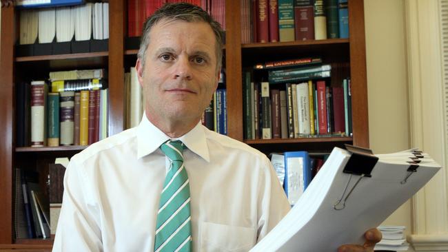 SA State Coroner Mark Johns in his office.